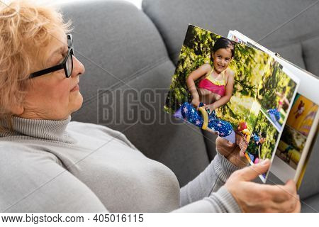 Women Watching Family Album At Home, Elderly Woman Watching Photobook