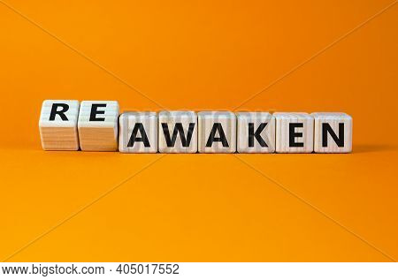 Reawaken Symbol. Turned Cubes And Changed The Word 'awaken' To 'reawaken'. Beautiful Orange Backgrou