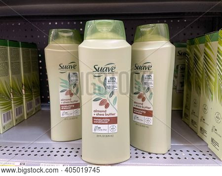 Suave Brand Conditioner Bottles On A Shelf At Walmart.
