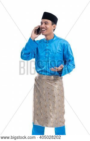 Male Muslim Talk On His Phone Over White