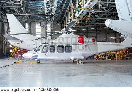 Moscow, Russia, July 02, 2013: Passenger Helicopter And Airplanes Under Maintenance. Checking Mechan