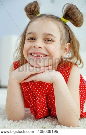 Little Girl Has No Tooth. The Child Has Lost A Baby Tooth. High Quality Photo