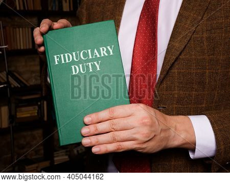 A Man Shows Fiduciary Duty Law Book.