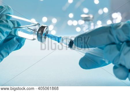 Doctor, Nurse, Scientist, Researcher Hand In Blue Gloves Holding Flu, Measles, Coronavirus, Covid-19