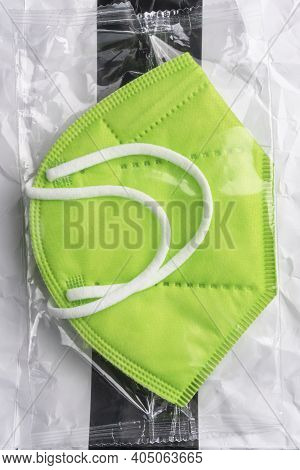 New Green Medical Protective Mask Kn 95 In Plastic Packaging. Close Up. Professional Respiratory Mas