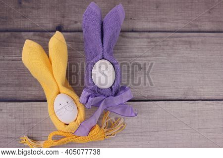 Happy Easter Concept.easter Holiday Table Setting With Eggs On Barn Boards. Rubbits From Eggs, Yello