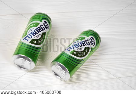 Kharkov, Ukraine - December 8, 2020: Aluminium Cans Of Green Tuborg Beer On Wooden Background. Tubor
