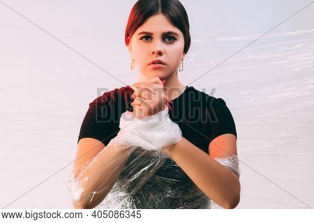 Human Trafficking. Female Slavery. Forced Labour. Art Portrait Of Insecure Victim Woman With Tied Ha