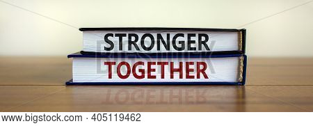 Stronger Together Symbol. Concept Words 'stronger Together' On Books On A Beautiful Wooden Table, Wh