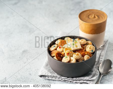 Mini Pancakes Cereal And Dalgona Coffee On Gray Cement Background, Copy Space. Trendy Food And Drink