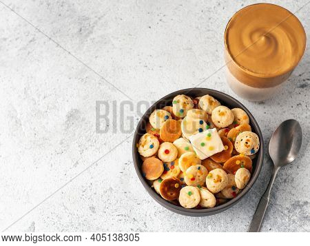 Mini Pancakes Cereal And Dalgona Coffee On Gray Cement Background Copy Space. Trendy Food And Drink 