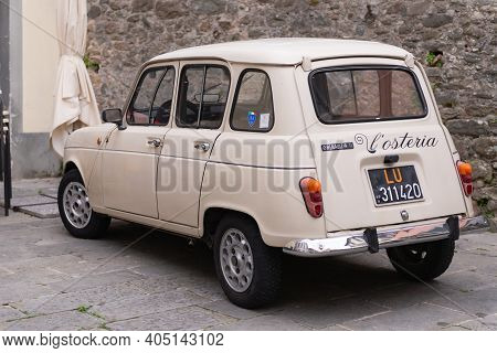 Barga. Italy. Summer 2019. Old Small Car In The City. Only Such A Car Can Move Around The Streets Of