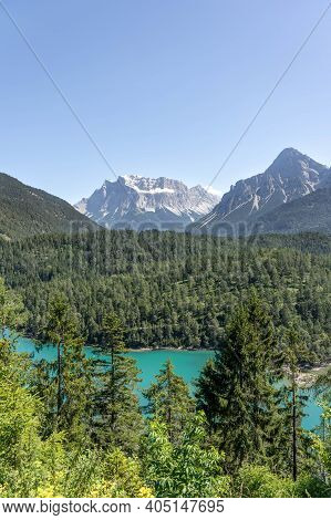 West Side View Of Snowy Zugspitze From Fernpass Austria Blindsee Lake