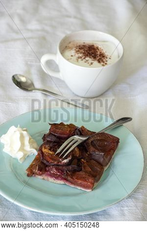 Bavarian Plum Cake With Cream And Cappucino