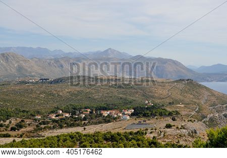European Countryside With Road And Village In The Mountains.