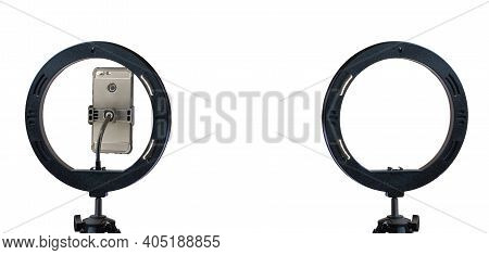 Ring Lamp And A Smartphone On A Tripod Isolated On A White Background With A Clipping Path.  Inexpen