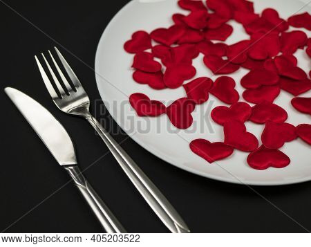 Dinner Of Heart Killer, Heartbreaker Or Casanova, A Lot Of Red Hearts On A White Plate On The Black 