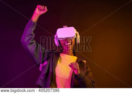 African American woman using virtual reality gadget for entertainment