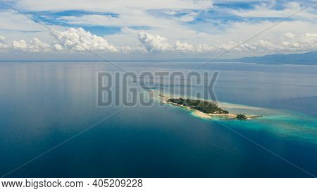 Top View Of Small Tropical Little Liguid Island In The Blue Sea With A Coral Reef And The Beach. Lit
