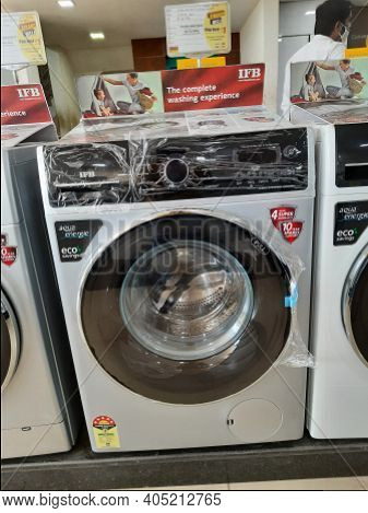 Closeup Of New Washing Machine, Mobile, Steamed Iron Box In A Girias Electronics Showroom At Gokul E