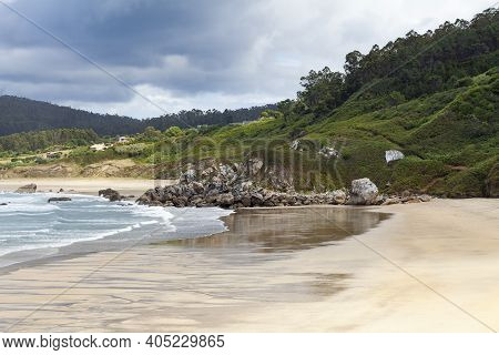 The Beach Of San Anton, Empty On A Cold And Cloudy Summer Day, In O Porto De Espasante, In The Ortig