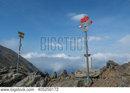 Hiking Signs At Malghera Pass At The Border Between Italy And Switzerland