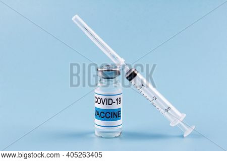 The Nobel Coronavirus Vaccine Covid-19 Is A Bottle With An Illustrative Picture And A Syringe For In