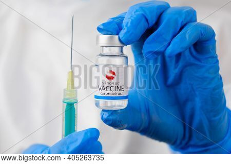 Sinovac Vaccine And Disposable Syringe For Injection In Doctors Hands. Prevention Of Coronavirus, Sa