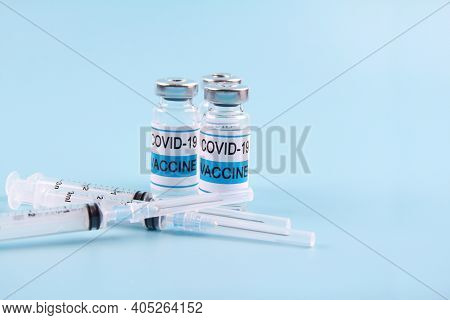 He Nobel Coronavirus Vaccine Covid-19 Is A Bottle With An Illustrative Picture And A Syringe For Inj