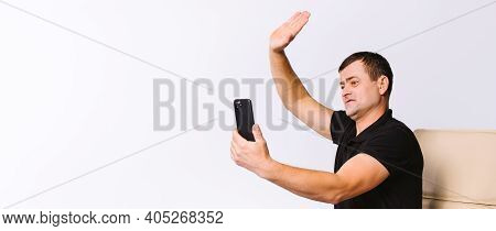 Banner, Long Format. Caucasian Man Communicates Non-verbally Via Video Communication, Greets While S