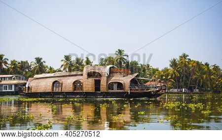 House-boat Pleasure Cruise Ship In India, Kerala On The Seaweed-covered River Channels Of Allapuzha 