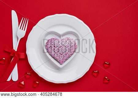 Valentines Day Background Or Concept With Empty Pink Plate And Whiteware On Scarlet Or Red Backgroun