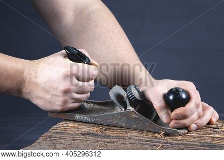 Work Of Carpenter. Handyman With Planer. Hand Holding Planer. Woodworking And Craft Of Carpenter. Ca