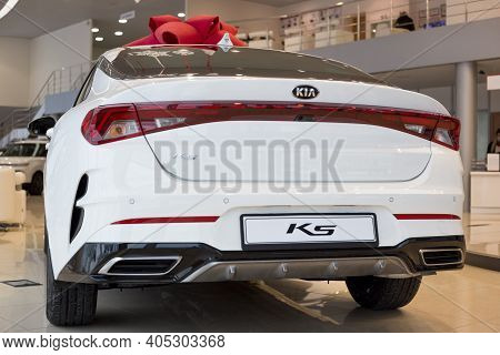 Russia, Izhevsk - December 28, 2020: Kia Showroom. New K5 Business Class Car In Dealer Showroom. Bac