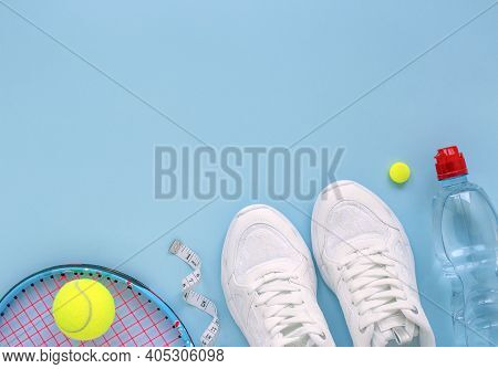 Summer Sport Concept With Tennis Ball And Racket , Sneakers, Bottle Of Water And Measuring Tape. Fla