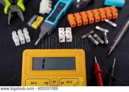 A Meter For Electrical Measurements On A Workbench. Accessories For Repair And Installation Of Elect