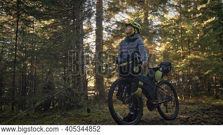 The Woman Travel On Mixed Terrain Cycle Touring With Bike Bikepacking. The Traveler Journey With Bic