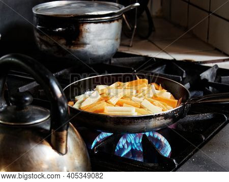 Flambe Chef Cooking In Kitchen. Professional Chef Flambe Style.