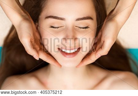 Face Building Facial Gymnastics Massage And Rejuvenating Exercises For Woman Face In Beauty Spa