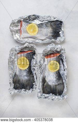 Fresh Raw Salmon Fillet Tail Part With, Lemon On A Light Background. Pescatarian Food Menu, Recipe. 
