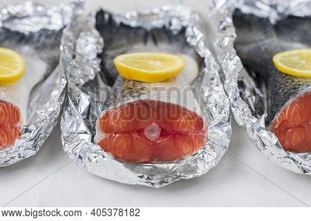 Fresh Raw Salmon Fillet Tail Part With Lemon On A Light Background. Pescatarian Food Menu, Recipe. R