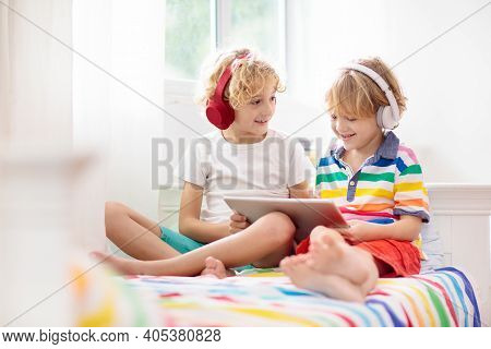 Child With Tablet Computer. Kids Study Online.