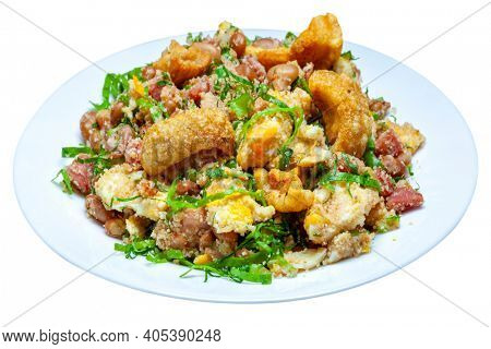 Brazilian food bean tropeiro with cracklings, bacon, cabbage, egg isolated on white background