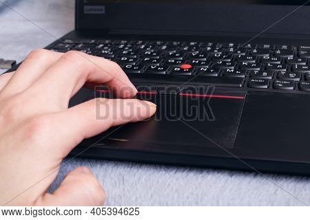 Belarus, Novopolotsk - 26 January, 2021: Hand And Black Lenovo Laptop Close Up