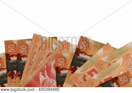 50 Canadian Dollars Bills Lies On Bottom Side Of Screen Isolated On White Background With Copy Space