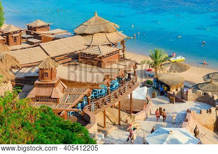 Sharm El Sheikh, Egypt - September 19, 2019: Unidentified People Are Relaxing On Beach Near Popular 