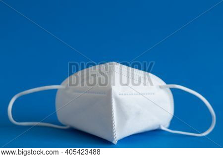 Ffp3 Mask, Nasal Drops, Thermometer, Tablets, Various Medicines Lie On The Table, Top View, On A Blu
