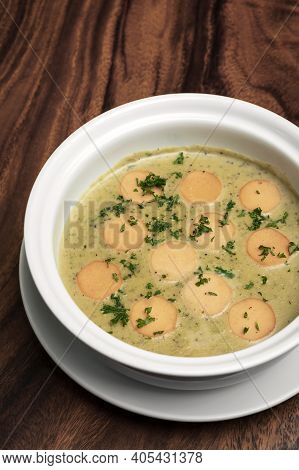 German Traditional Kartoffelsuppe Potato And Sausage Soup On Wood Table Background