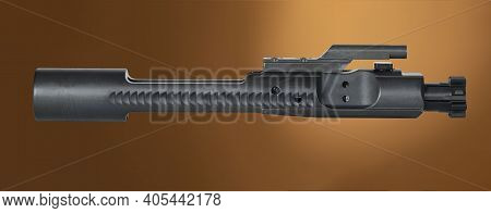 Tan Background With A Black Ar-15 Bolt Carrier Group Above