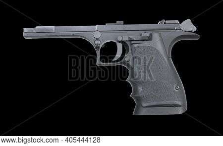 Frame For A Semi-automatic Handgun That Has Its Slide And Magazine Removed That Is On A Black Backgo